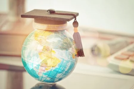 Graduate Study Abroad Concept, Graduation Cap On Top Earth Globe Model Map With Radar Background. Graduate Study Abroad Program And Back To School And Studies Lead To Success In World Wide.
