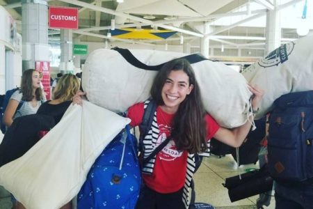 Class Afloat student with their duffle, ready to begin their semester at sea, traveling and studying abroad.