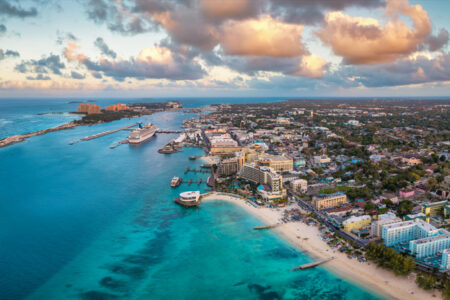 Aerial Sunset View Of Nassau Town And Harbour With Junkanoo Beach At The Western Esplanade